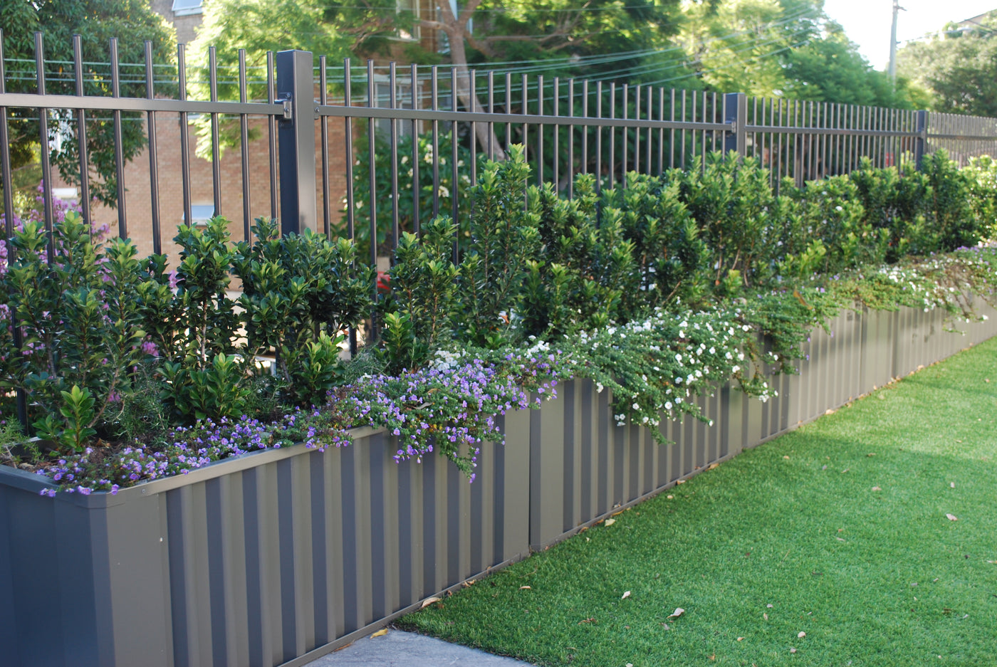 WaterUps planter installation for a residential balcony hedge