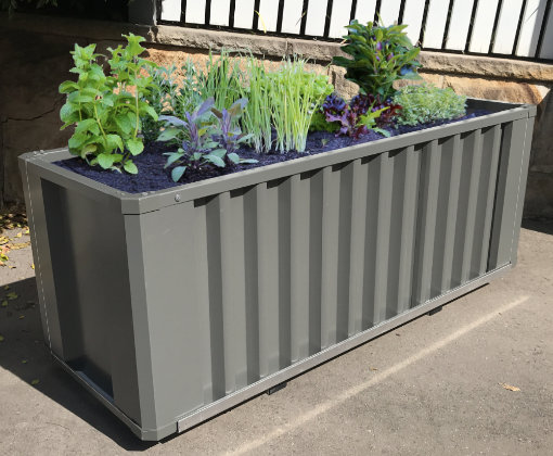 The WaterUps Oasis raised garden beds are like self watering pots using innovative wicking technology to water plants above.